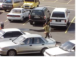 A citizen searches for her car in the country's first formal parking lot, recently opened.  Photo by the author.