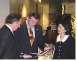 EVP Koonce (left), discusses with Director Ridge and Secretary Chao a briefing book prepared for the Labor Department of the Institute's work on the issue of building security and design. Photo by Douglas E. Gordon, Hon. AIA.