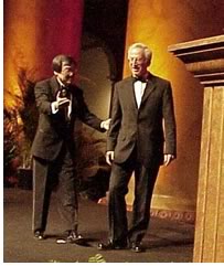 Chong escorts Twenty-five Year Award winner Jaume Freixa to the awards podium.