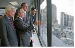 New York City Mayor Michael Bloomberg, New York Gov. Pataki, and Lower Manhattan Development Corporation Chairman John C. Whitehead as they tour the New Family Room at the LMDC. Courtesy of the New York City mayor's office.