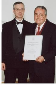 Melillo (right) receives AIA Kentucky's highest honor, the Julian Oberwarth Award, from 2001 AIA Kentucky President Joseph E. Jones, AIA during ceremonies in October 2001.