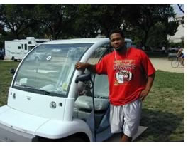 Tuskegee team member Steven Johnson shows off the team's electric car.
