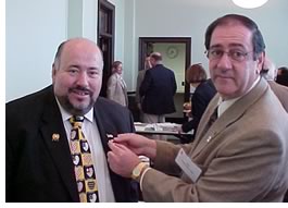 NJAPAC Chair Harold Lichtman, AIA, presents an AIA "America by Design" lapel pin to State Assemblyman Joe Doria (D-31).