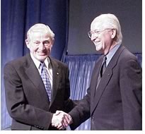 Graves shakes hands with past AIA President John Anderson, FAIA, during the 2001 AIA Convention in Denver. About the award Graves said, “I am so pleased at this award-above all others—because it is an award from my peers.” (AIA Photo)