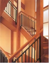 The higher the house goes, the more space you get. An open, engineered-wood staircase saves square feet in plan yet creates a visual expanse. (Baylis Architects)