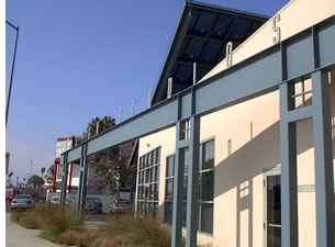 Morse-Boudreaux Architects continued the building's industrial aesthetic in the PV array steel-frame structure.