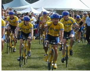 With Lance Armstrong at the front, second from left, the Tour of Hope riders head for the finish line on their 3,500-mile race against the clock. Michael Siegel, AIA, is just rounding the corner on the right.