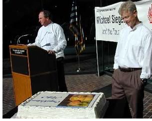 A cake and a cheering crowd greeted Siegel at the AIA national component headquarters October 11 as AIA Executive Vice President/CEO Norman L. Koonce, FAIA, welcomed him. 