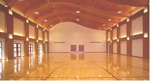 Undulating glu-lam beams create the gymnasium/banquet rooms interesting ceiling.