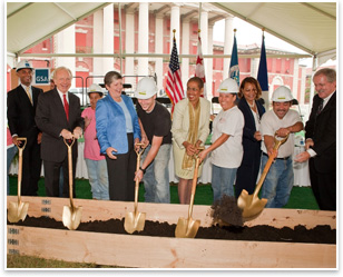 Joining four members of the construction team (in hard hats) at the St. Elizabeths site September 7 for the groundbreaking ceremony are, from left, D.C. Mayor Adrian Fenty (in a GSA hardhat), Sen. Joseph Lieberman, DHS Secretary Janet Napolitano, Rep. Eleanor Holmes Norton, GSA National Capital Region Acting Regional Administrator Sharon Banks, and GSA Acting Administrator Paul Prouty. Photo courtesy GSA.