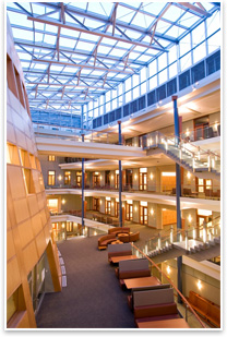 The glass, daylit atrium, with glass rails, creates a transparent circulation space. Photo courtesy of Georgetown University.