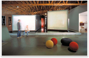 Jigsaw, Los Angeles, Floating edit studios with ping-pong-ball walls. The film editing profession requires small, dark environments free from distraction and light reflectionin essence, hermetically sealed boxes. Yet, at the same time, a film editing company, if it is to be competitive, must exist in a stimulating, socially interactive workspace alive to workers and clients alikea place where people will want to be.